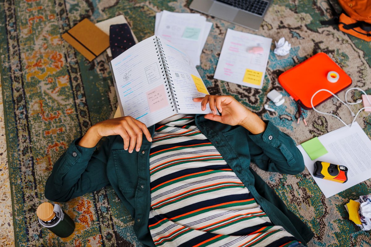 Student relaxing with notes